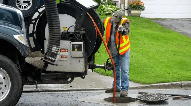 Technician using specialized drainage equipment for sewer line cleaning and foundation protection in Yonkers, NY